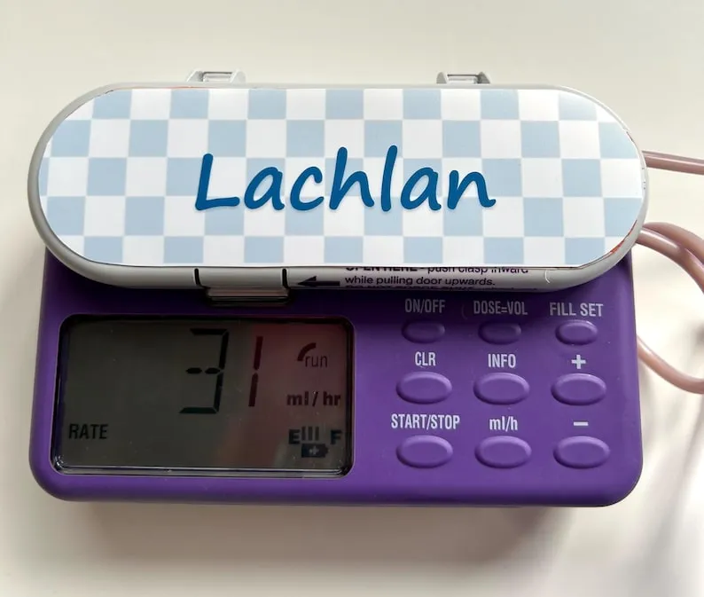 Checkerboard Name sticker on a feeding tube pump