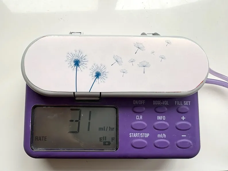 Dandelions sticker on a feeding tube pump